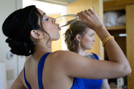 Me as a bridesmaid drinking to my friend's health. [Jennifer May Photography]